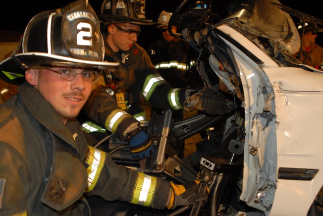 Firefighter Barnes using the Hurst Hydraulic tools at recent training exercise